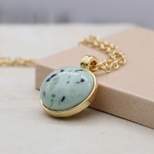 Golden Necklace with Large Green Speckled Resin Stone by Peace of Mind